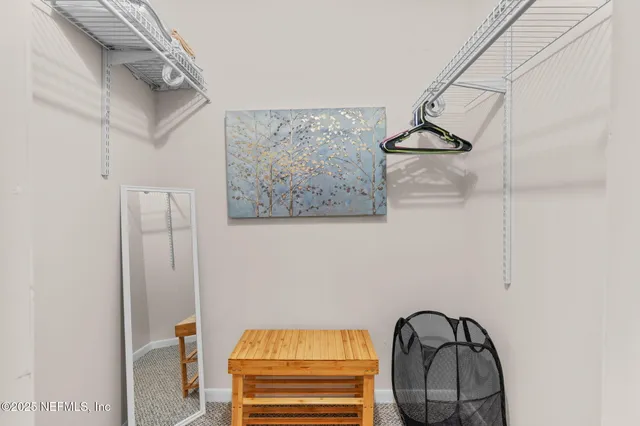 a bedroom with bed and a couch