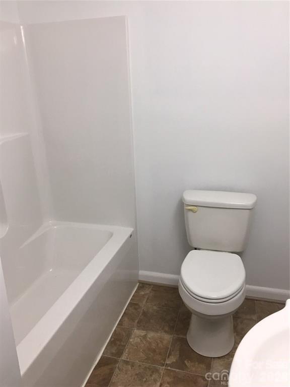 201 Bethlehem Church Road Grover, NC 28073 - Photo 4 of 4 a white toilet sitting next to a bath tub