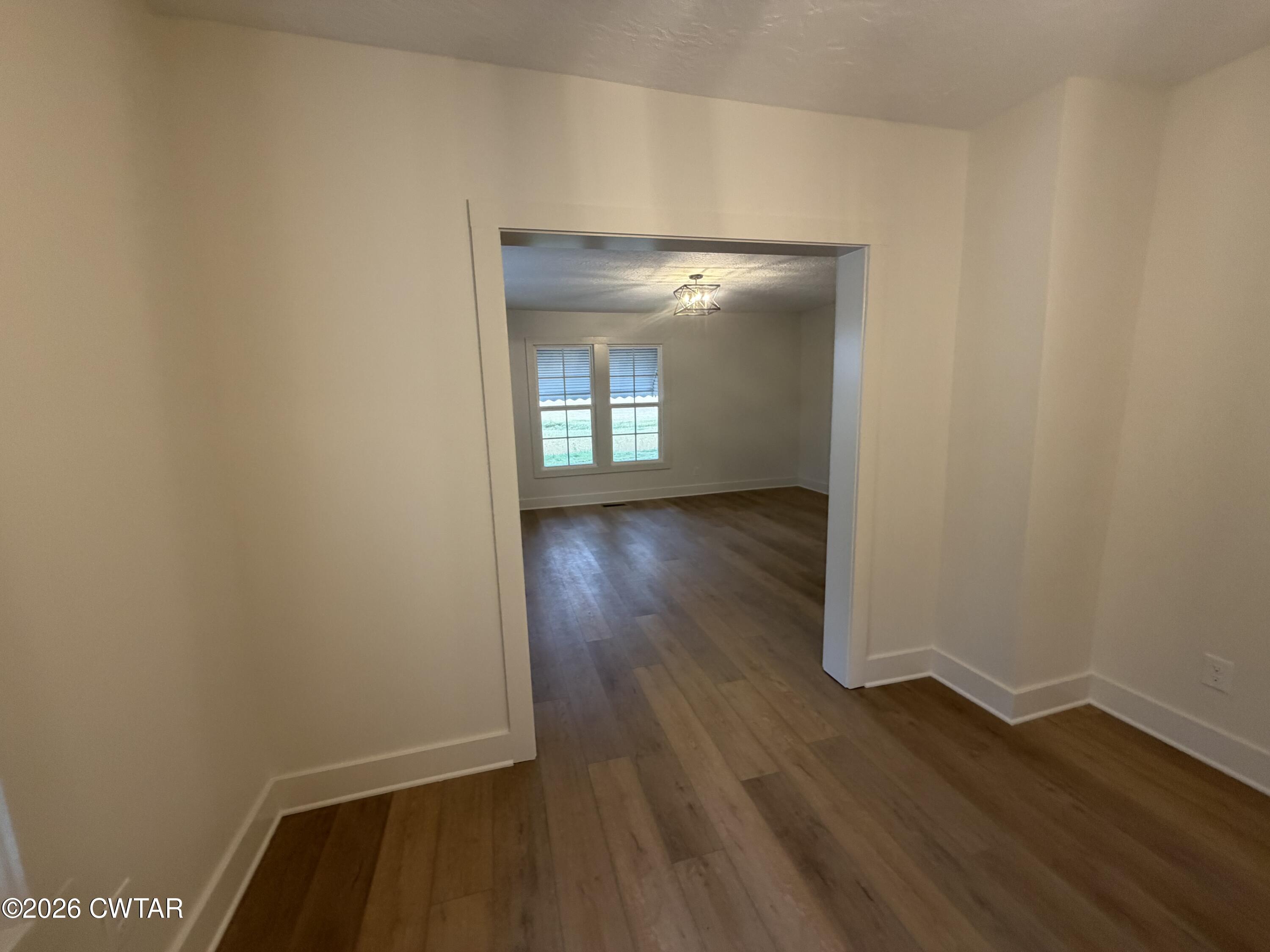 16 Manner Frank Road Milan, TN 38358 - Photo 7 of 25 a view of a room with wooden floor and a window