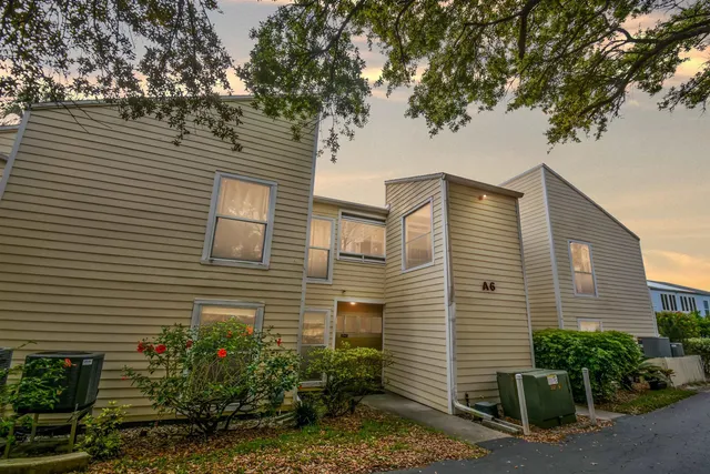 a view of a house with a yard and plants