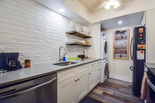 a kitchen with a sink and cabinets