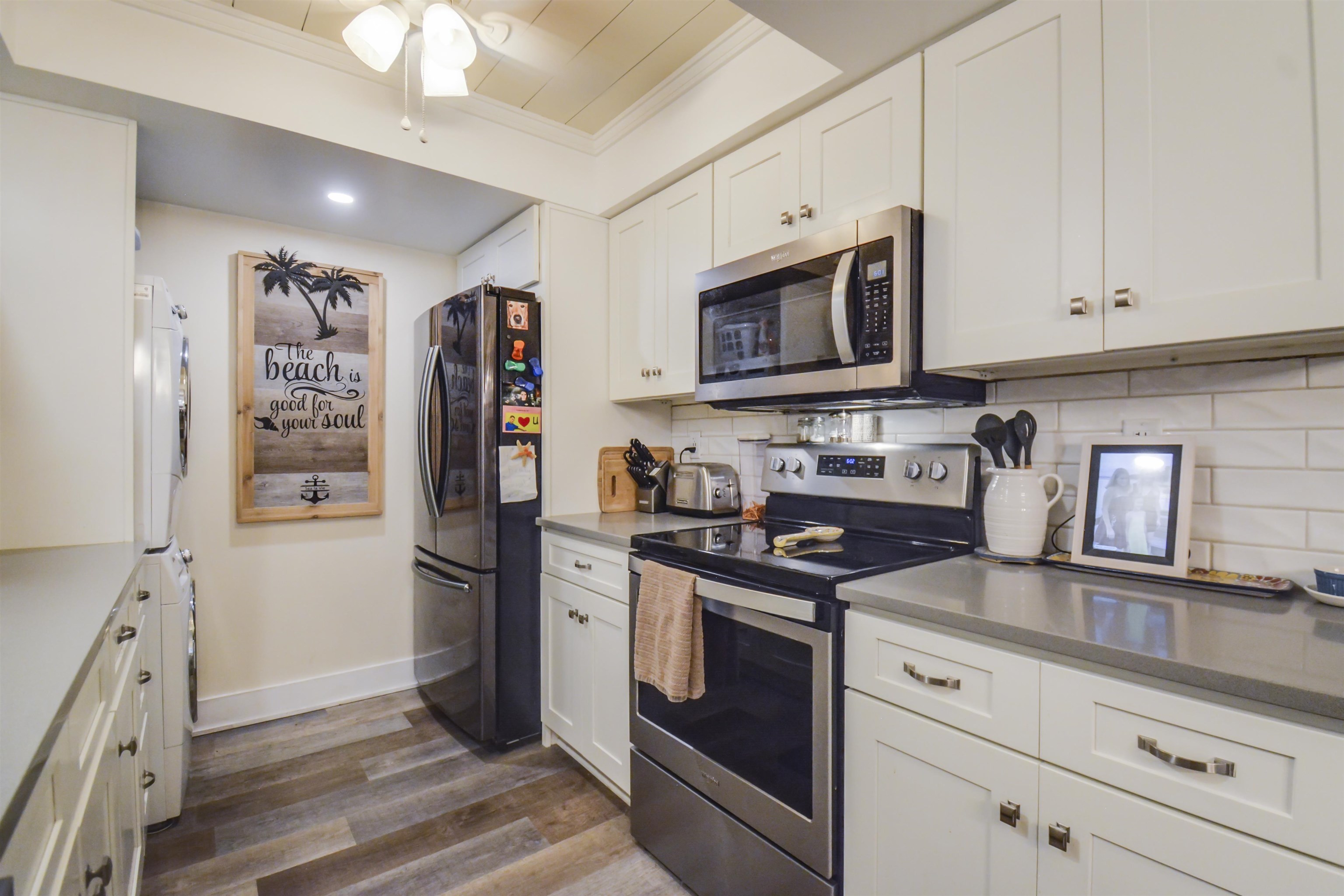 6300 A1A South St. Augustine, FL 32080 - Photo 19 of 42 a kitchen with stainless steel appliances granite countertop a stove microwave and refrigerator