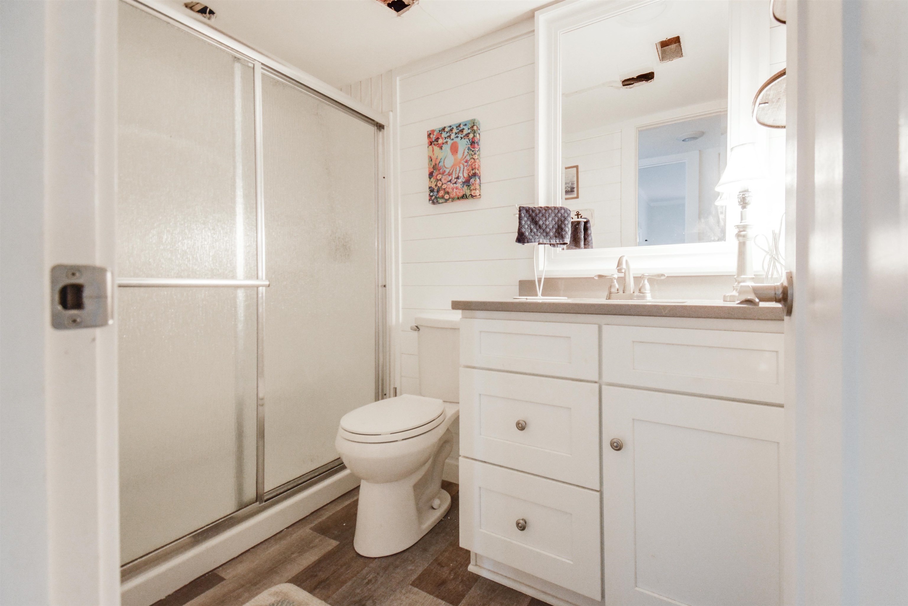 6300 A1A South St. Augustine, FL 32080 - Photo 23 of 42 a bathroom with a sink a toilet and shower