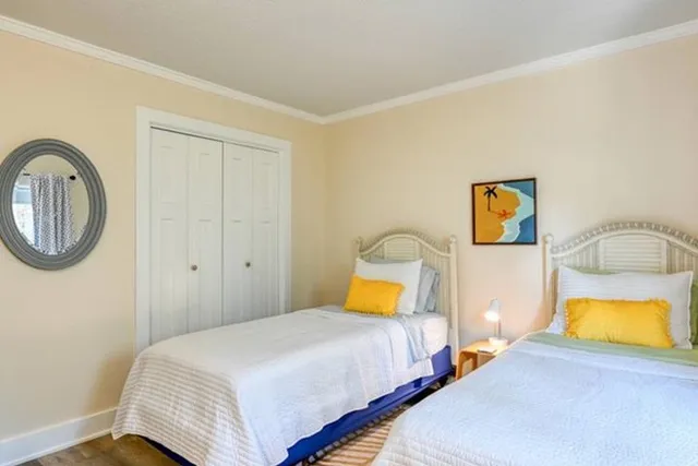 a bedroom with a bed and a lamp