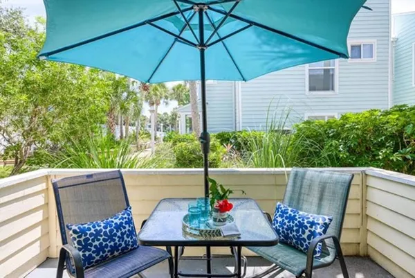 a view of an outdoor sitting area with furniture
