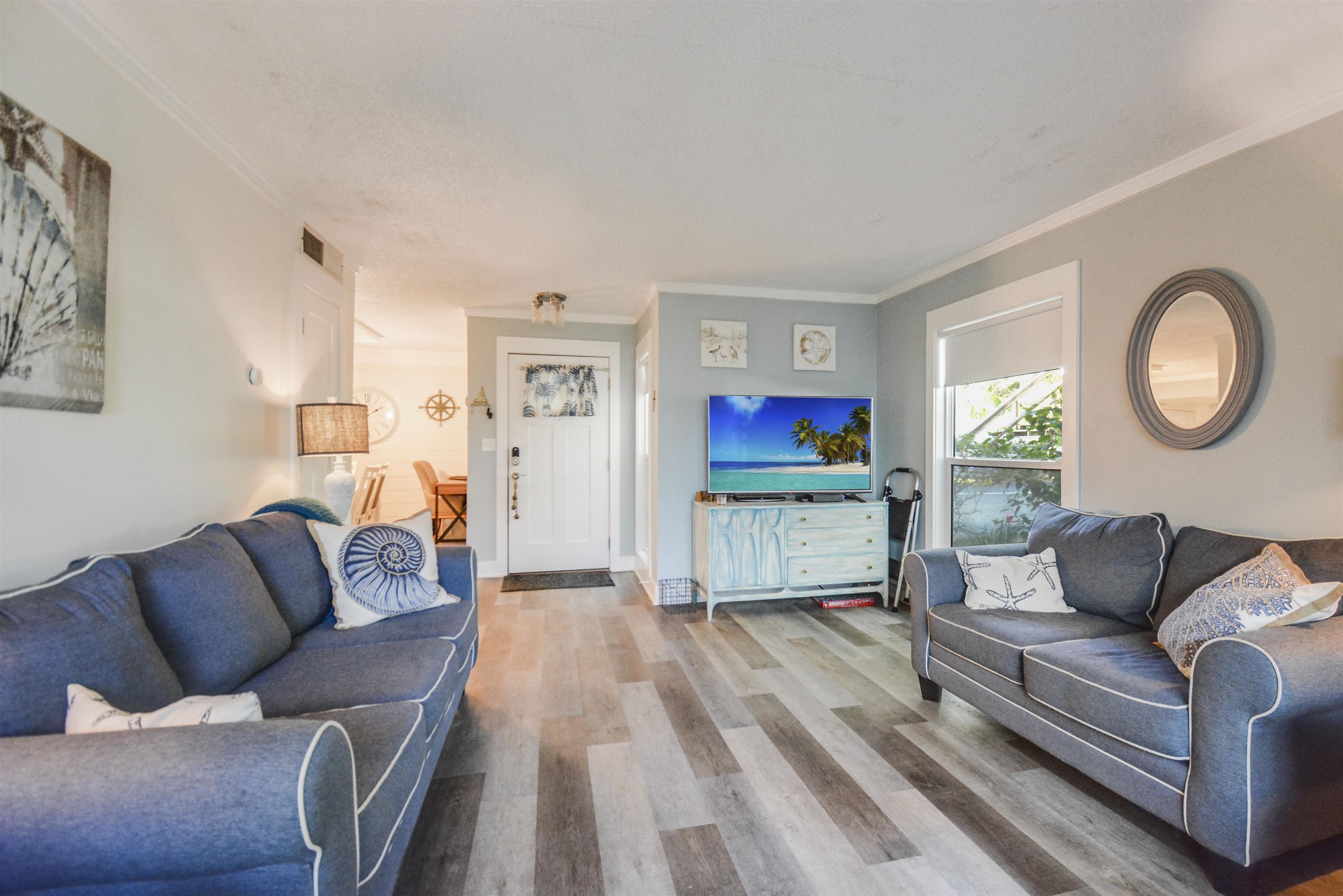 6300 A1A South St. Augustine, FL 32080 - Photo 5 of 42 a living room with furniture and a wooden floor