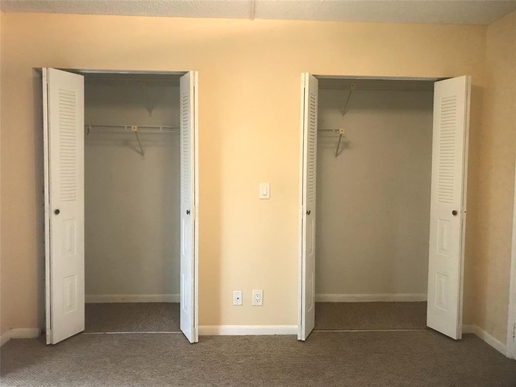 1401 Southwest 135th Terrace, Unit 307H Pembroke Pines, FL 33027 - Photo 7 of 13 an empty room with closet and a bathroom