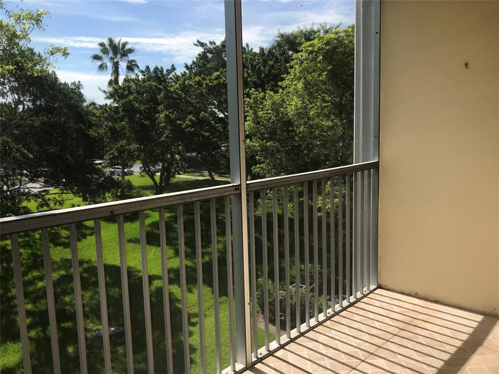 1401 Southwest 135th Terrace, Unit 307H Pembroke Pines, FL 33027 - Photo 8 of 13 a view of a balcony