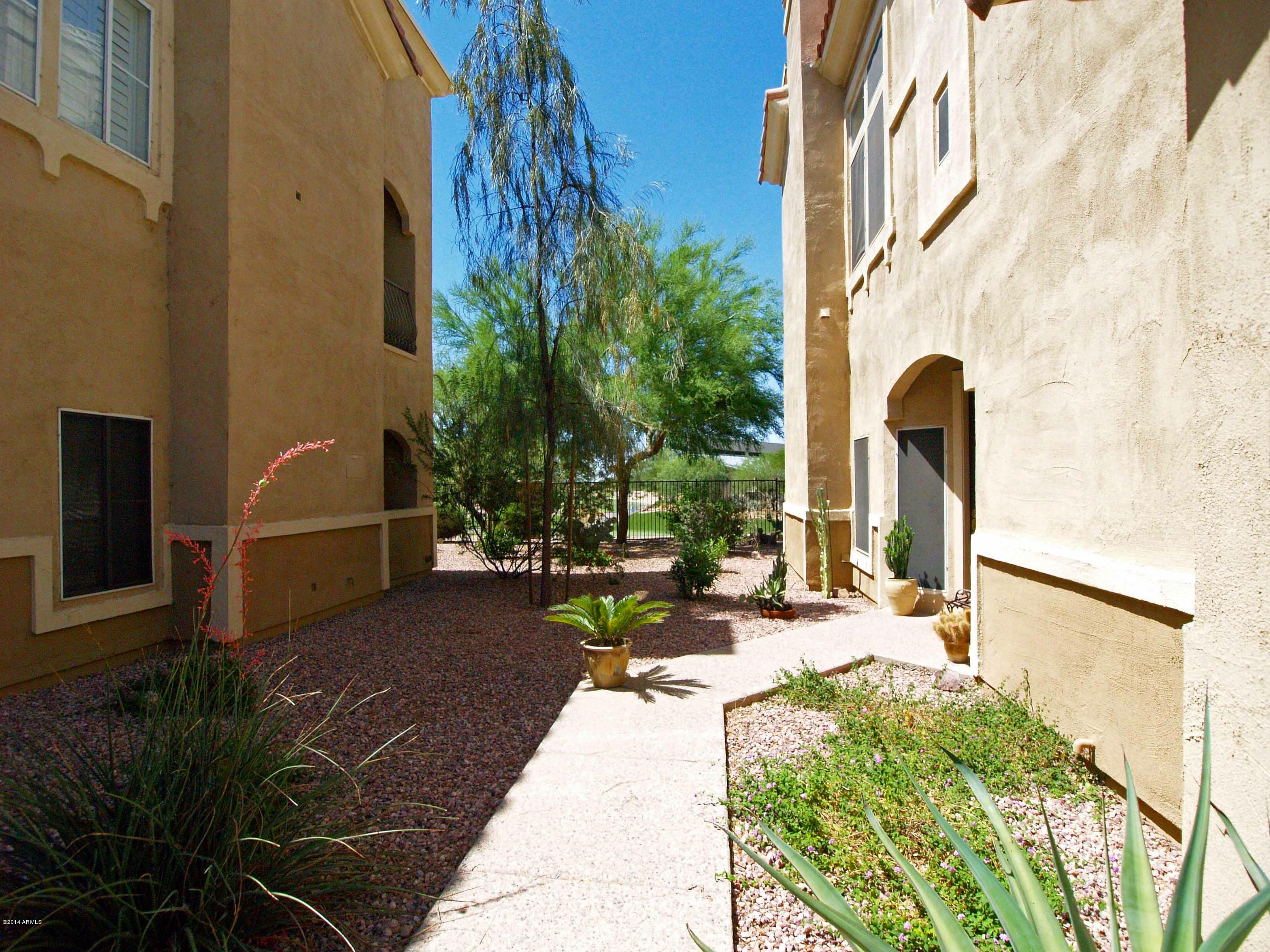 8245 East Bell Road, Unit 226 Scottsdale, AZ 85260 - Photo 46 of 69 WALKWAY FACING GOLF COURSE