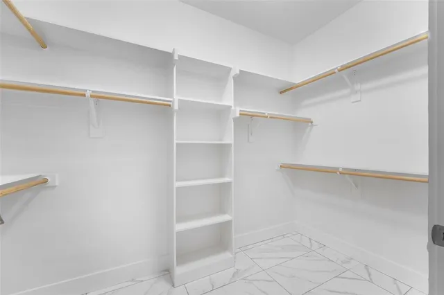a view of an empty walk in closet