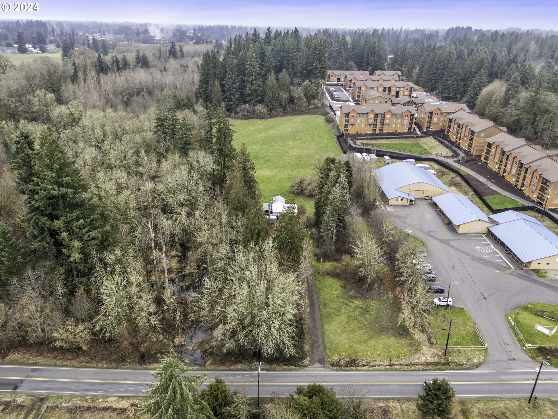 1804 Northeast 179th Street Ridgefield, WA 98642 - Photo 3 of 12 an aerial view of a residential apartment building with a garden