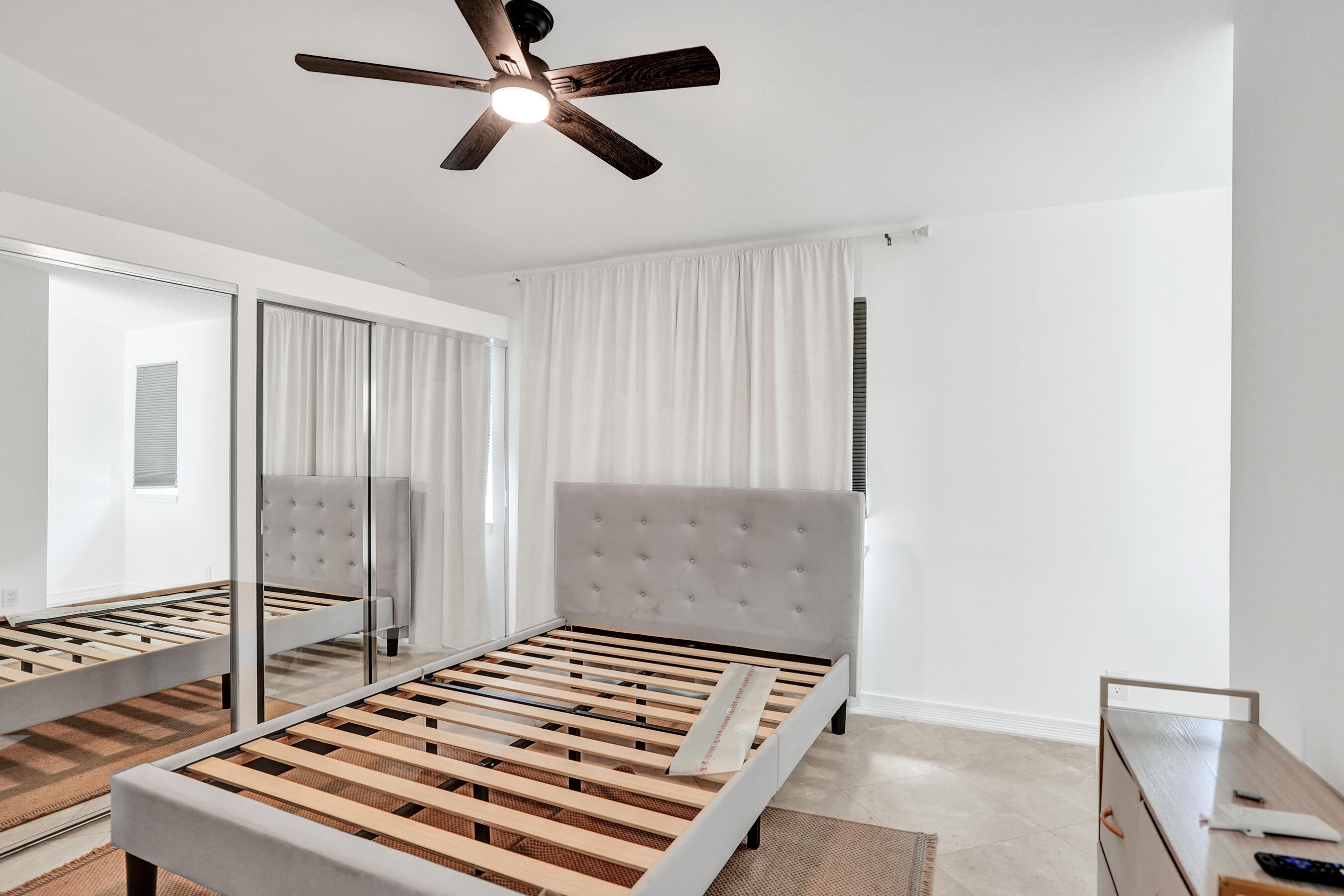 147 Southwest 3rd Street Pompano Beach, FL 33060 - Photo 23 of 29 a bedroom with a bed and a window