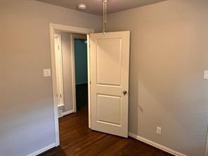 8926 Angleton Place Dallas, TX 75243 - Photo 11 of 19 a view of a room with wooden floor
