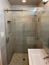 a bathroom with a shower and a toilet