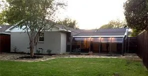 a view of house with yard