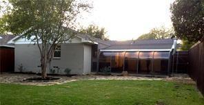 8926 Angleton Place Dallas, TX 75243 - Photo 18 of 19 a view of house with yard