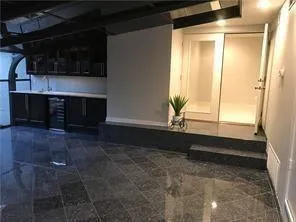 a living room with a fireplace and a window