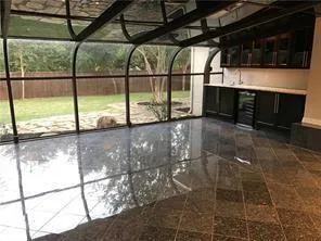 a view of a glass door with a hallway