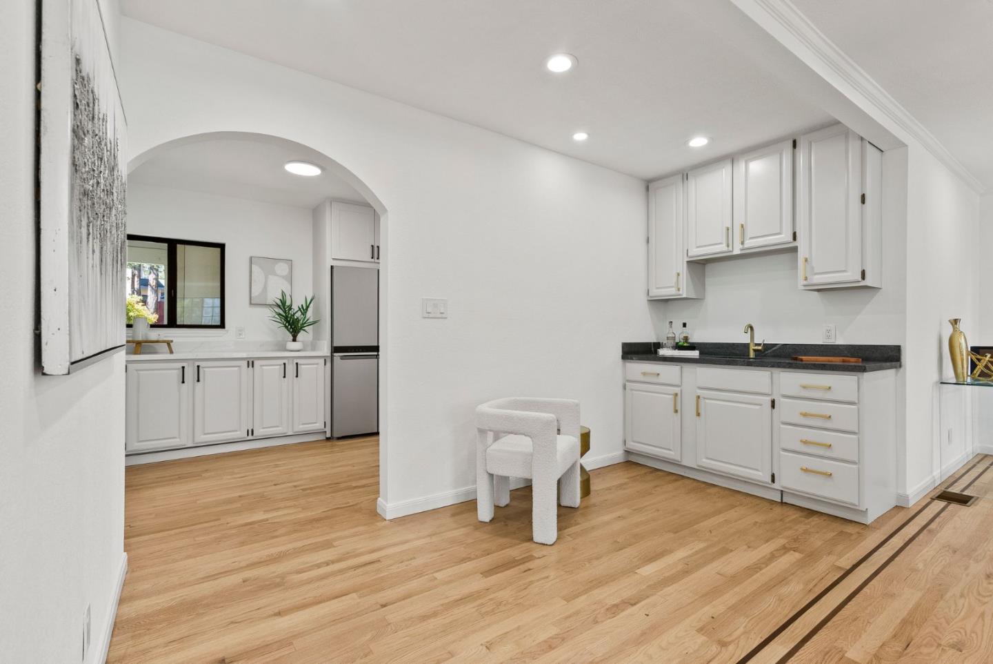 1475 Oak Rim Drive Hillsborough, CA 94010 - Photo 11 of 72 a kitchen with a sink cabinets and wooden floor