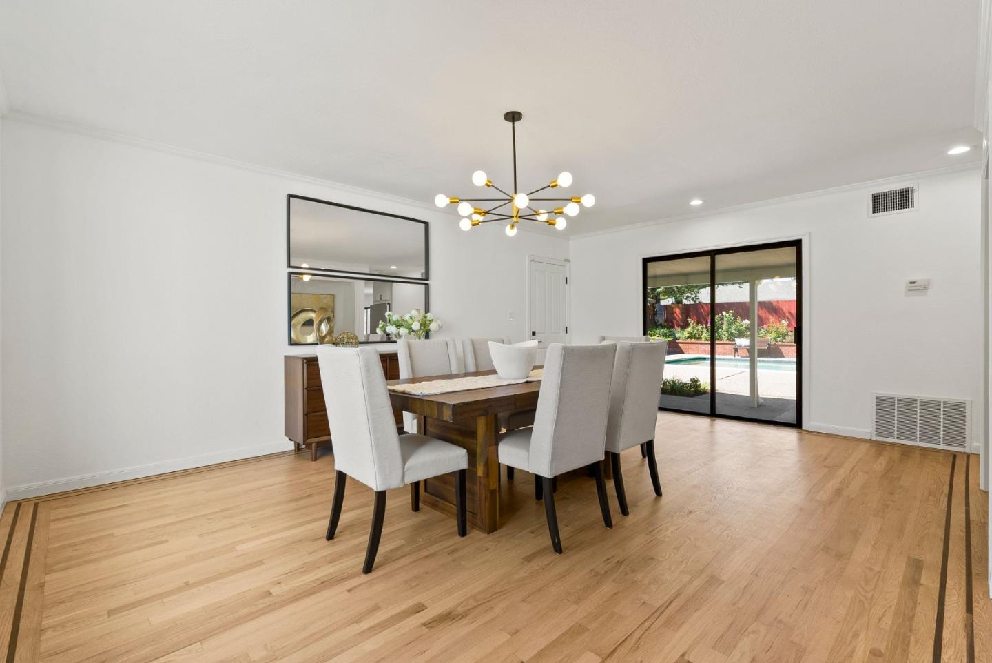 1475 Oak Rim Drive Hillsborough, CA 94010 - Photo 13 of 72 a dining room with furniture wooden floor and a rug