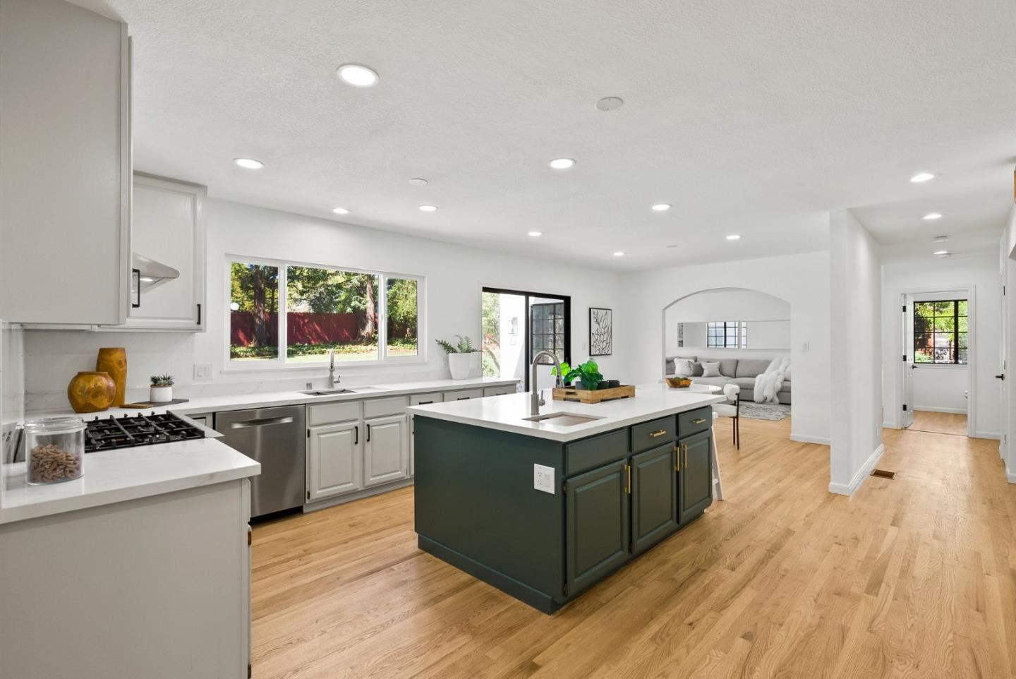 1475 Oak Rim Drive Hillsborough, CA 94010 - Photo 16 of 72 a kitchen with stainless steel appliances granite countertop a stove and a sink