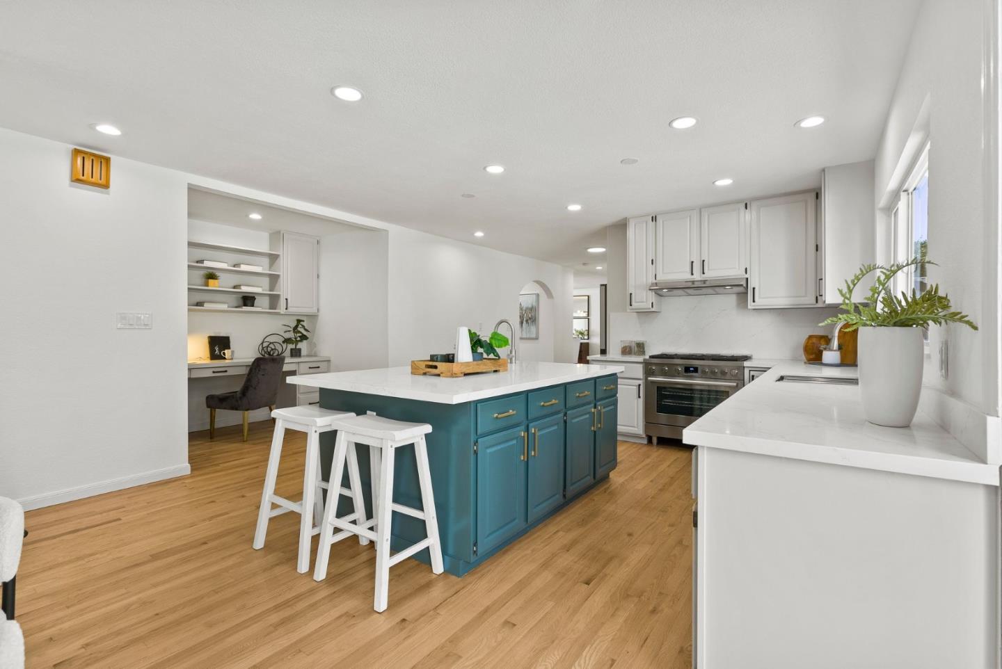 1475 Oak Rim Drive Hillsborough, CA 94010 - Photo 18 of 72 a kitchen with a table chairs sink and cabinets