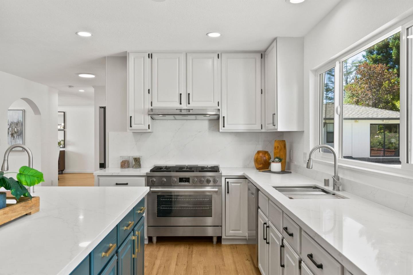 1475 Oak Rim Drive Hillsborough, CA 94010 - Photo 20 of 72 a kitchen with a sink stove top oven and cabinets