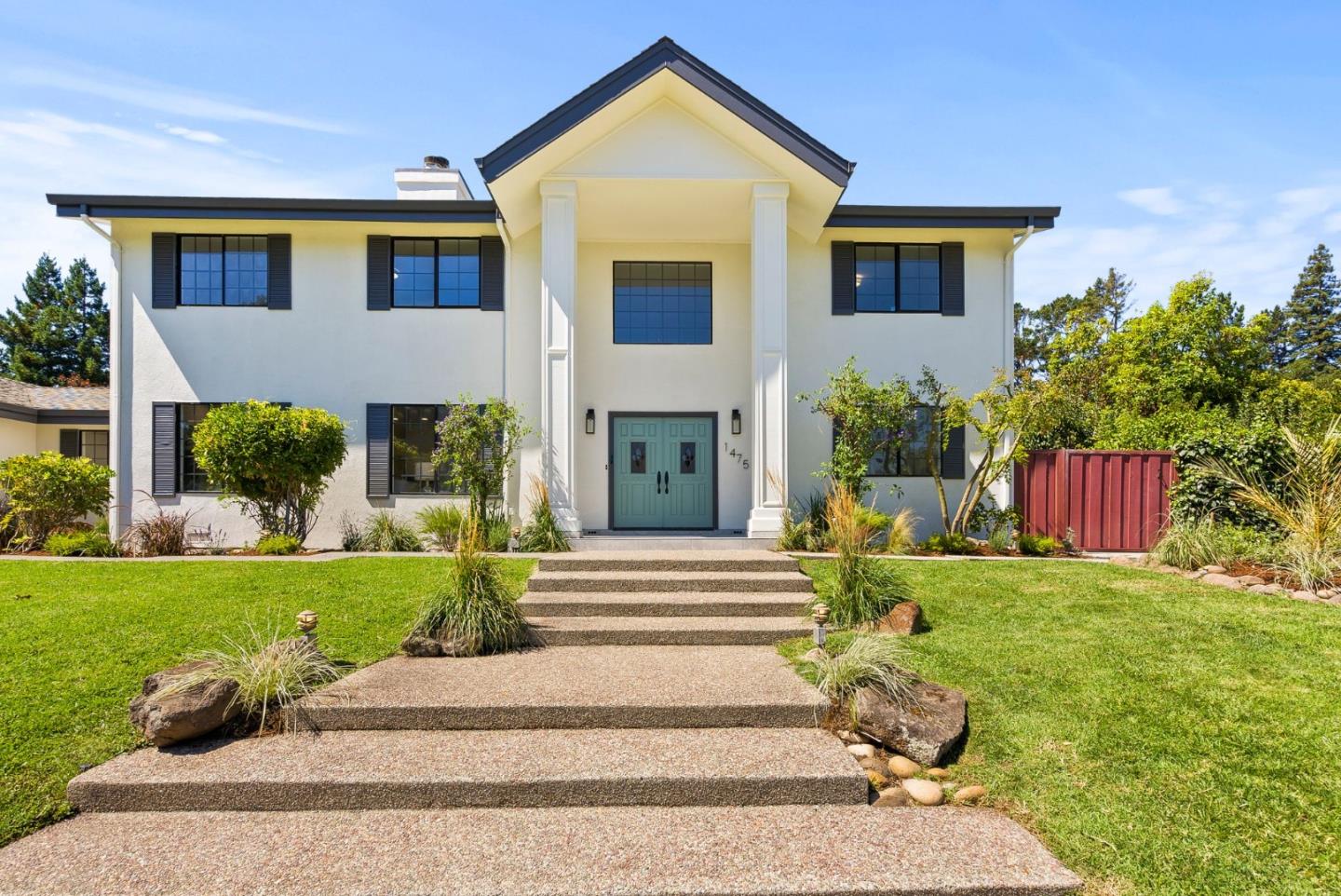 1475 Oak Rim Drive Hillsborough, CA 94010 - Photo 2 of 72 a front view of a house with a yard