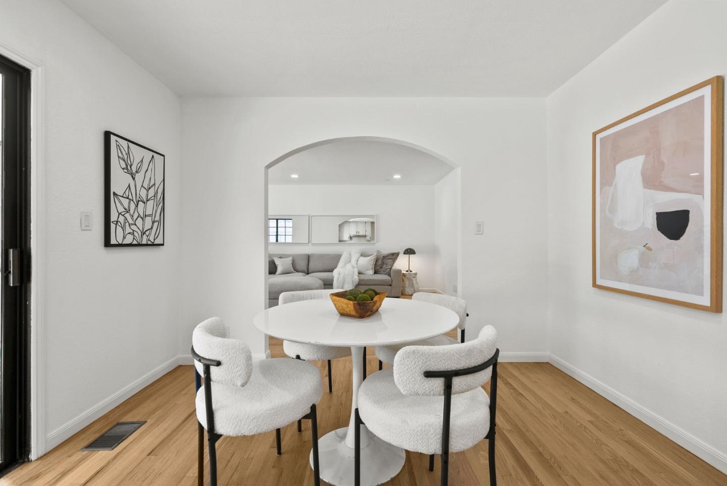 1475 Oak Rim Drive Hillsborough, CA 94010 - Photo 23 of 72 a view of a dining room with furniture and wooden floor