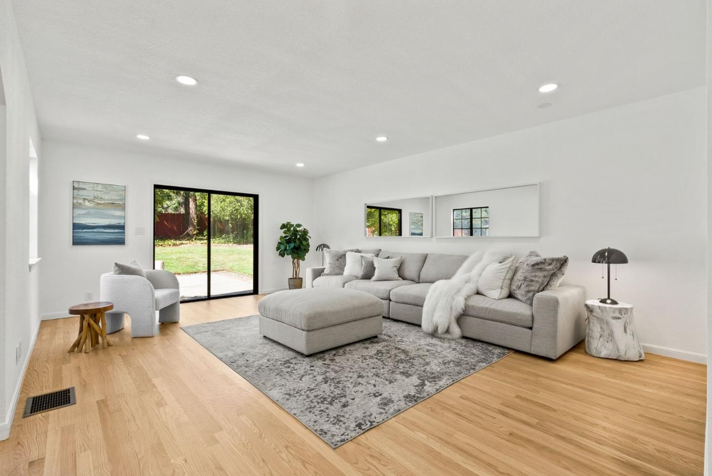 1475 Oak Rim Drive Hillsborough, CA 94010 - Photo 24 of 72 a living room with furniture and a large window