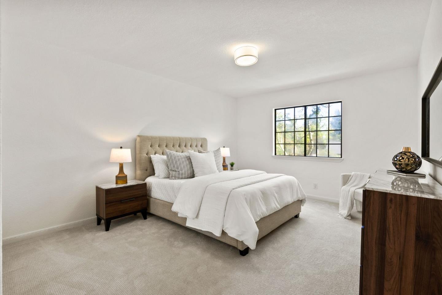 1475 Oak Rim Drive Hillsborough, CA 94010 - Photo 27 of 72 a bedroom with a bed and window