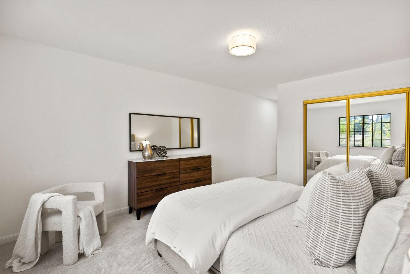 1475 Oak Rim Drive Hillsborough, CA 94010 - Photo 28 of 72 a bedroom with a bed and wooden floor