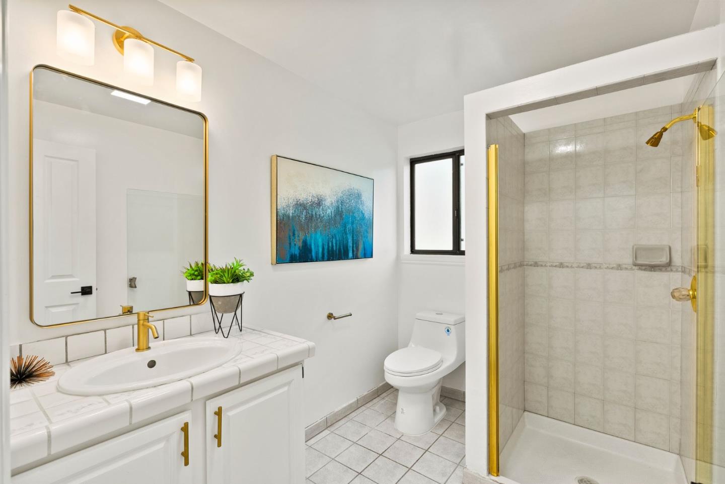 1475 Oak Rim Drive Hillsborough, CA 94010 - Photo 29 of 72 a bathroom with a sink a toilet and shower