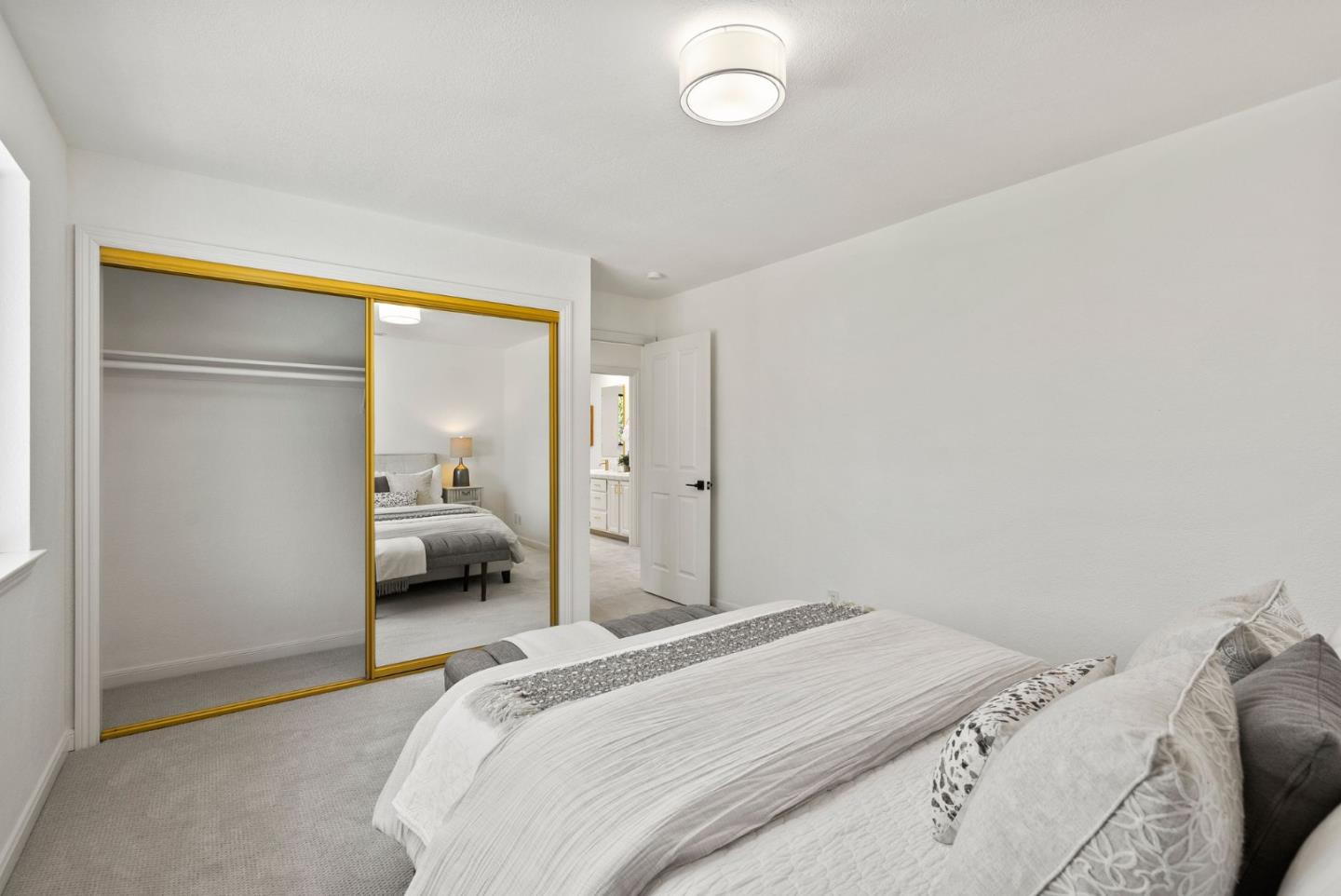 1475 Oak Rim Drive Hillsborough, CA 94010 - Photo 37 of 72 a bedroom with a bed and a mirror