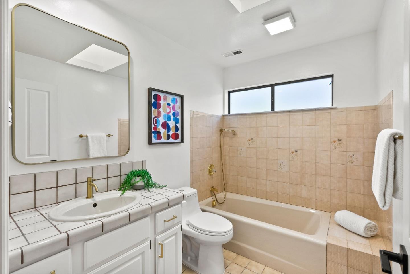 1475 Oak Rim Drive Hillsborough, CA 94010 - Photo 39 of 72 a bathroom with a sink a toilet and shower