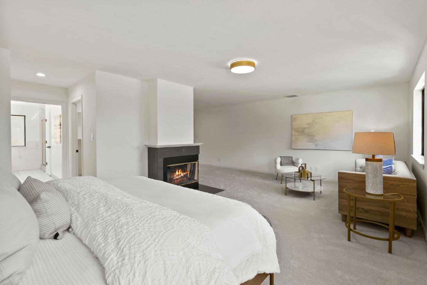 1475 Oak Rim Drive Hillsborough, CA 94010 - Photo 47 of 72 a spacious bedroom with a bed and a chair