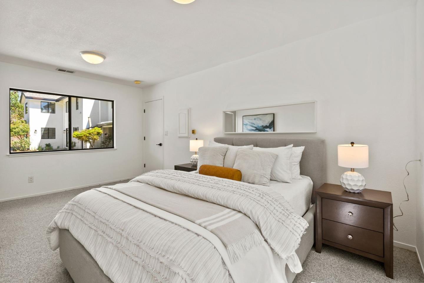 1475 Oak Rim Drive Hillsborough, CA 94010 - Photo 56 of 72 a bedroom with a bed and a painting on the wall