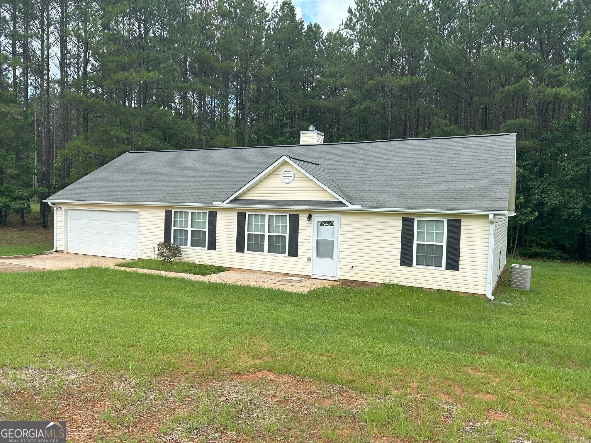 134 Cemetary Road Luthersville, GA 30251 - Photo 2 of 18 a house that has a big yard with large trees