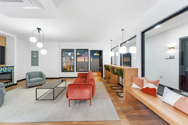 a living room with furniture and a table