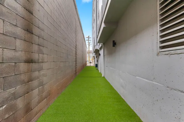 a view of a pathway with a yard