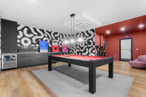 a bedroom with furniture and lamp