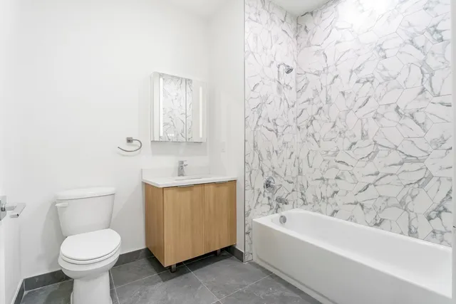 a bathroom with a toilet sink and bathtub