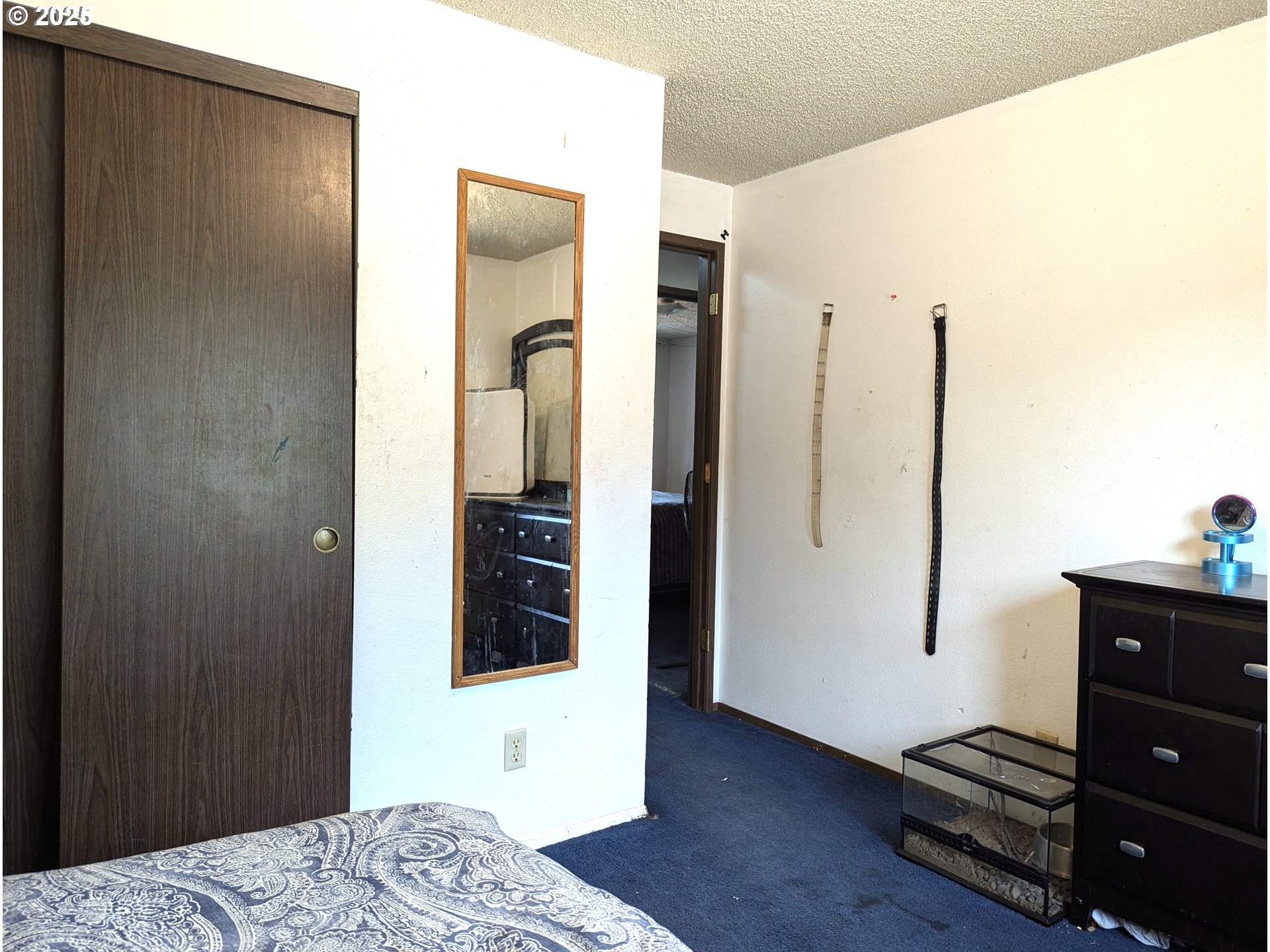 47696 West 1st Street Oakridge, OR 97463 - Photo 11 of 20 a bedroom with a bed and wooden floor