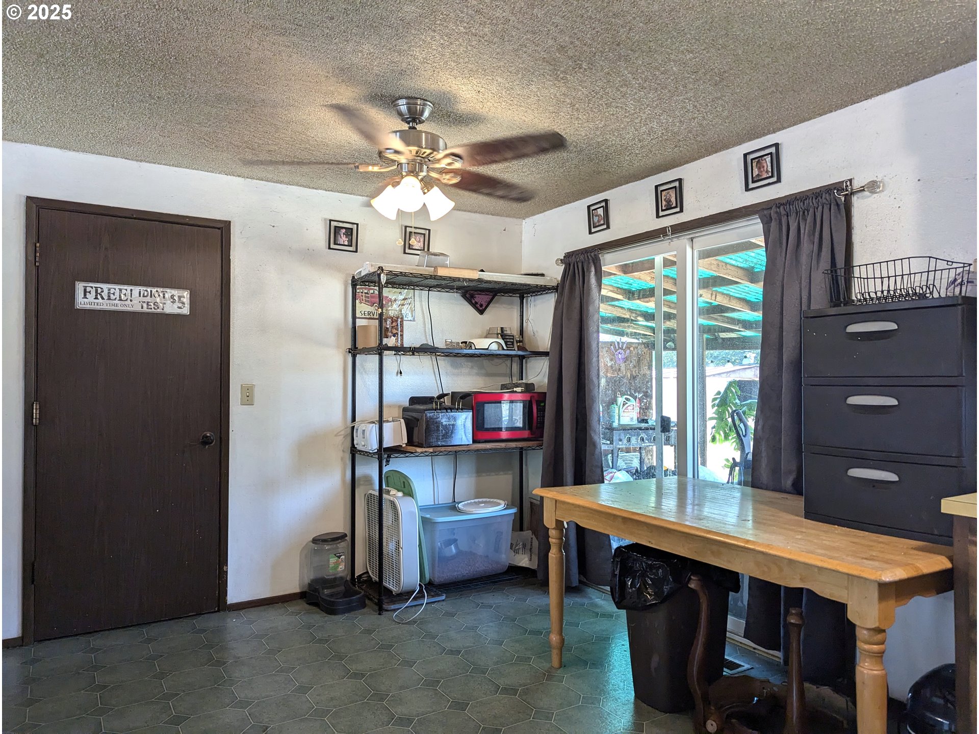 47696 West 1st Street Oakridge, OR 97463 - Photo 12 of 20 a room with a table chairs and a window