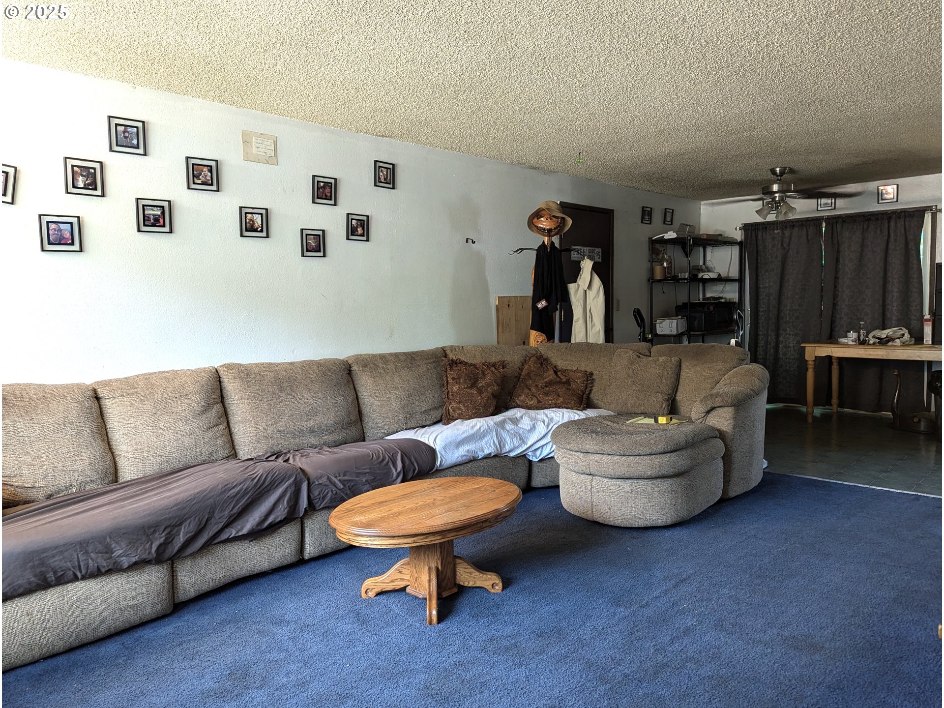 47696 West 1st Street Oakridge, OR 97463 - Photo 16 of 20 a living room with furniture and a dining table with wooden floor