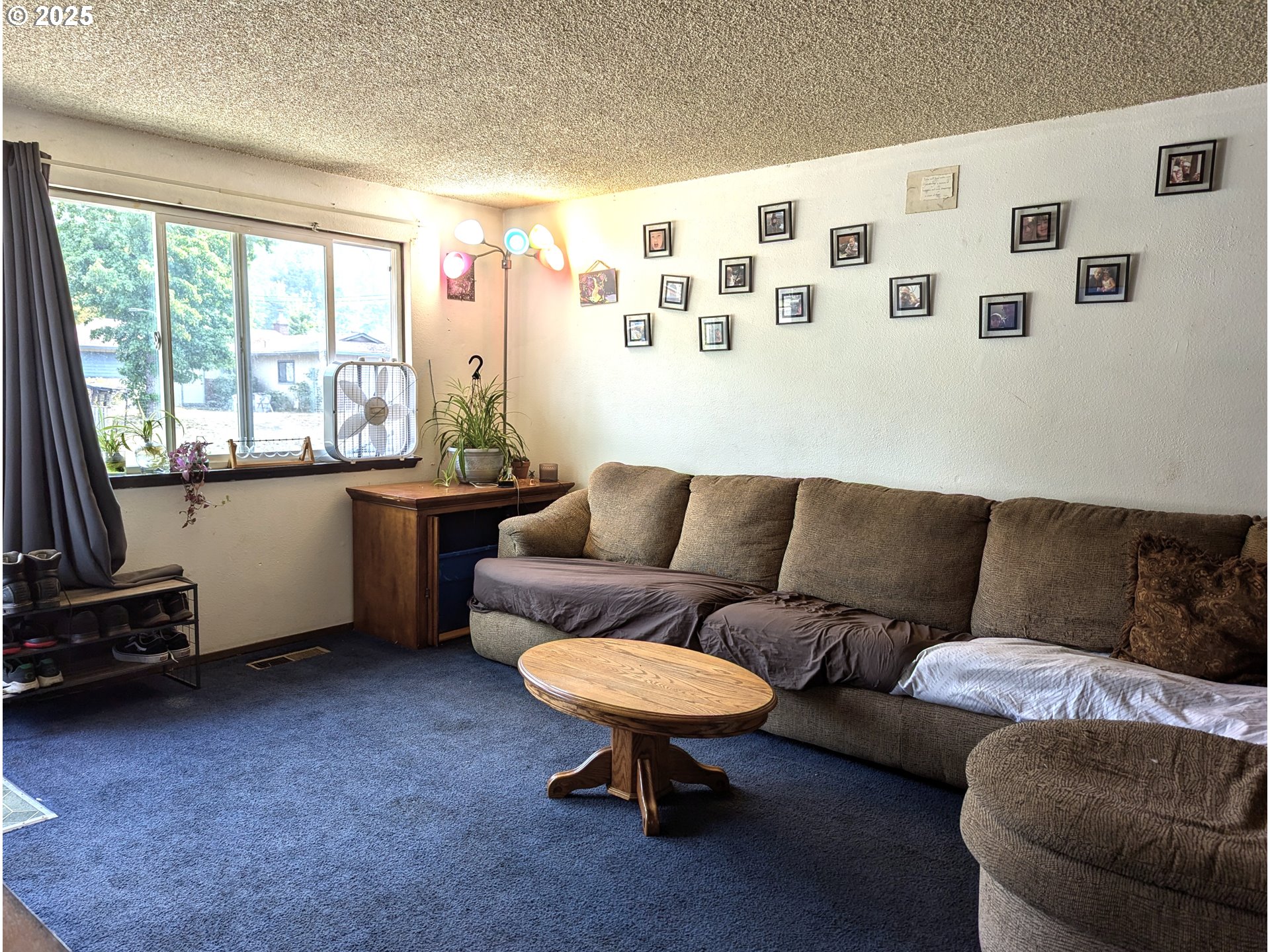 47696 West 1st Street Oakridge, OR 97463 - Photo 18 of 20 a living room with furniture and a large window