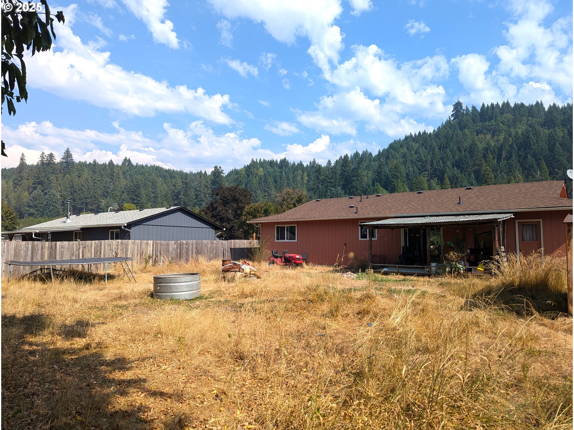 47696 West 1st Street Oakridge, OR 97463 - Photo 2 of 20 a house with swimming pool in front of it