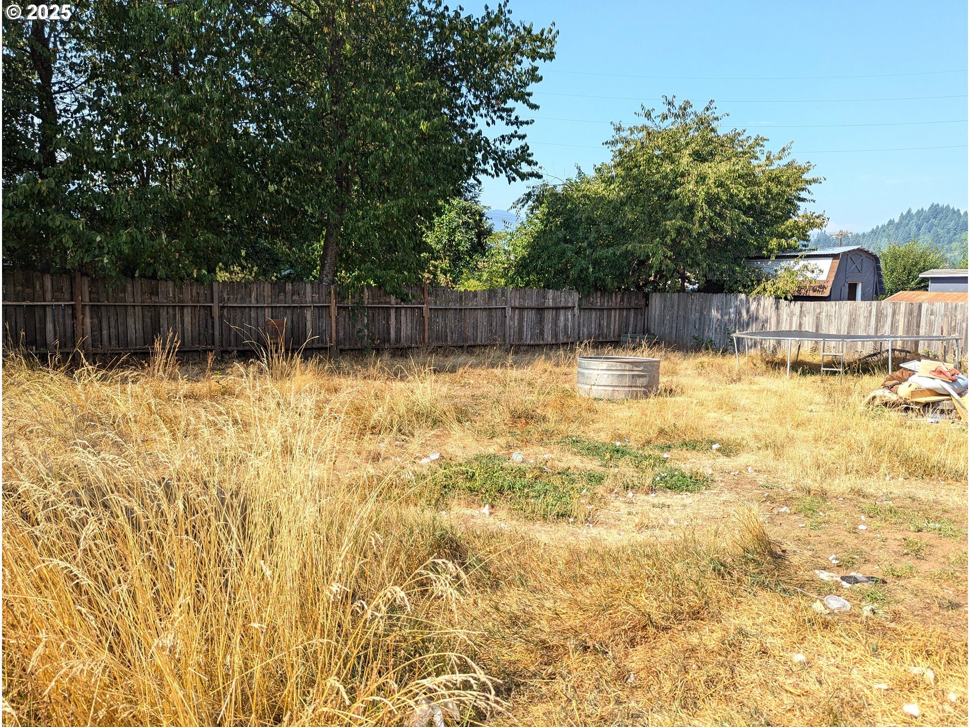 47696 West 1st Street Oakridge, OR 97463 - Photo 5 of 20 a swimming pool that is in the backyard of a house