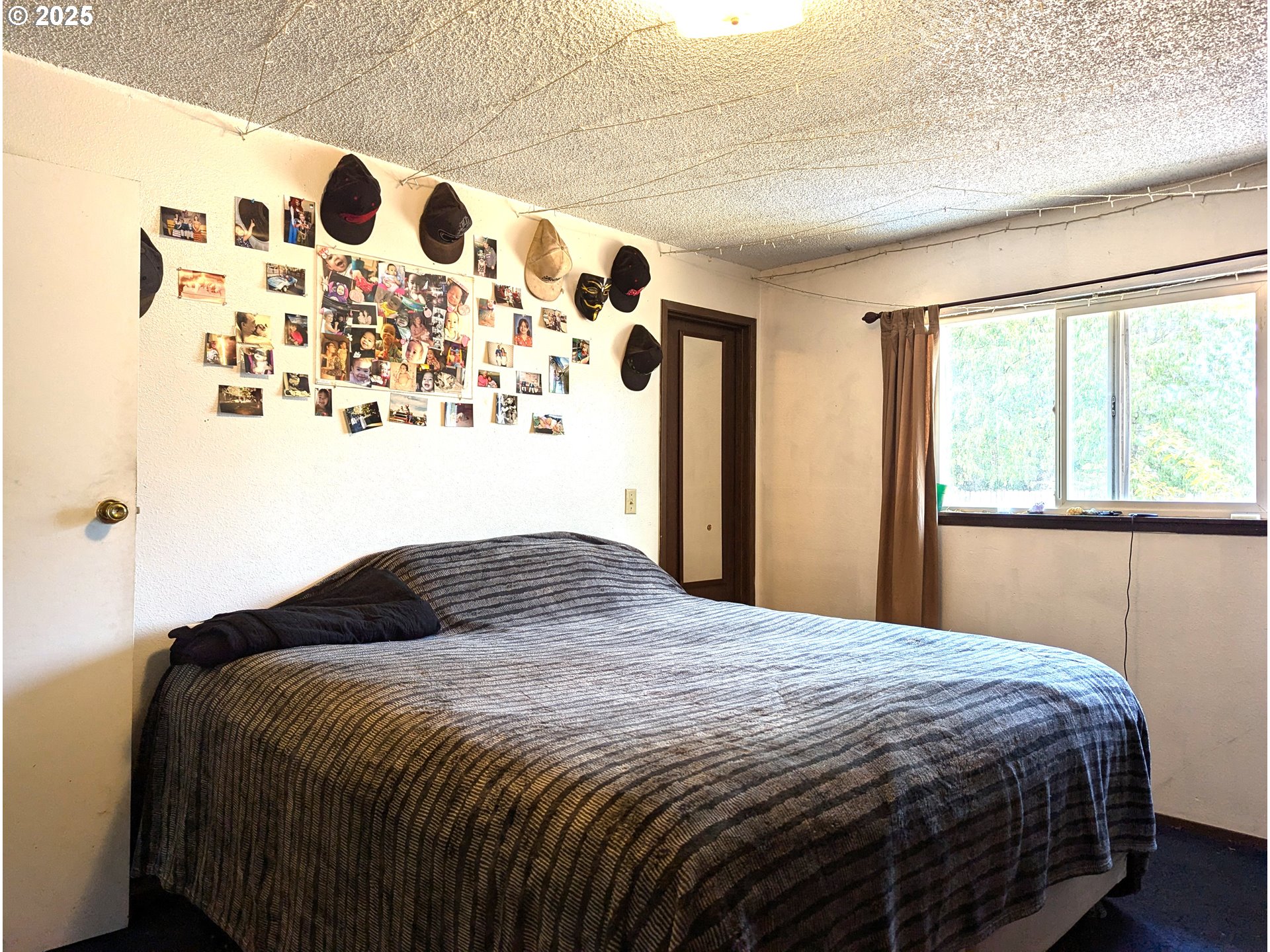 47696 West 1st Street Oakridge, OR 97463 - Photo 7 of 20 a bedroom with a bed and a window