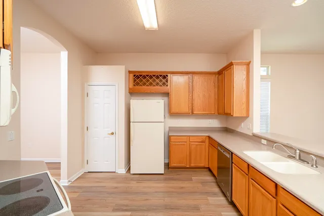 a spacious bathroom with a bathtub sink and mirror
